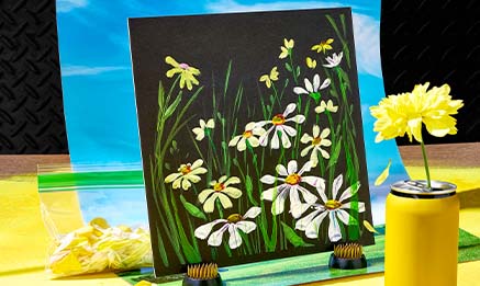 Brightly painted white flowers on black canvas.