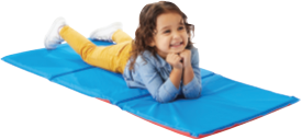 Young child lays on their stomach on a light blue rest mat.