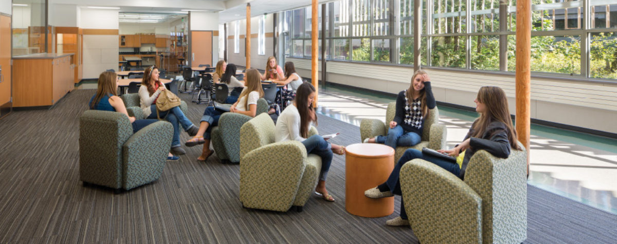 Commons area with people sitting in armchairs.